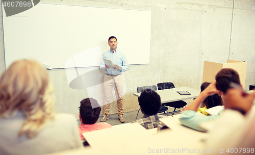 Image of group of students and teacher at lecture