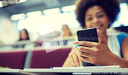 Image of close up of african student with smartphone