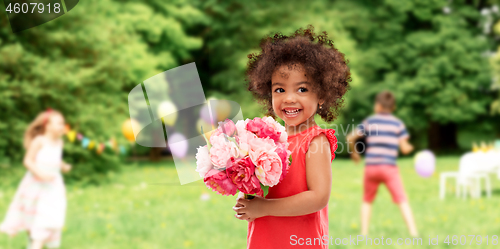 Image of happy little african american girl with flowers