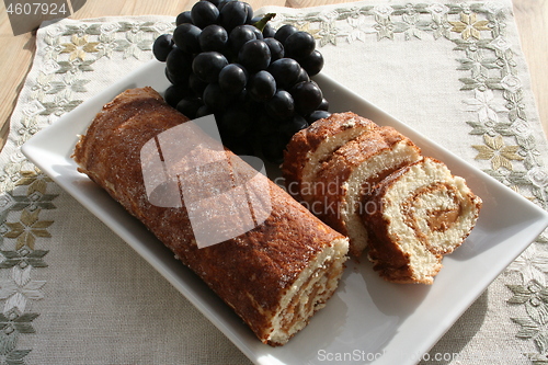 Image of Pastry with almond cream - blue grapes in background