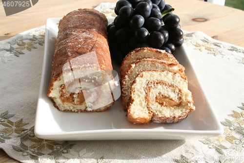 Image of Pastry with almond cream - blue grapes in background