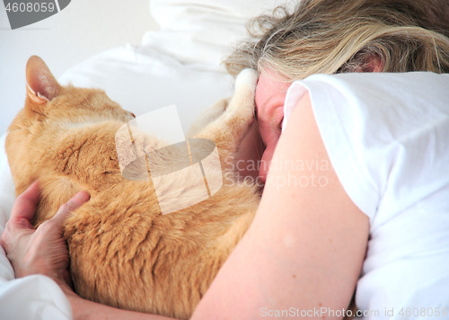 Image of Female and her cat.