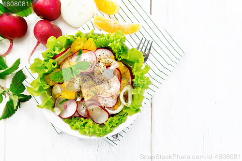 Image of Salad of radish and orange with mint on board top