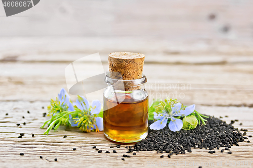 Image of Oil kalingi in bottle on old board