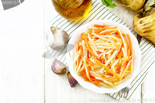 Image of Salad of parsnip and carrot on board top
