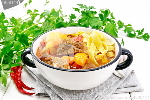 Image of Lagman in bowl on light board