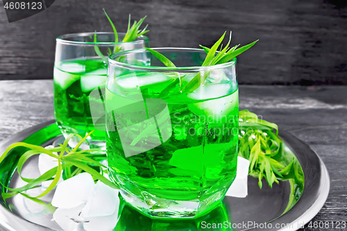 Image of Lemonade Tarragon with ice in two glasses on wooden board