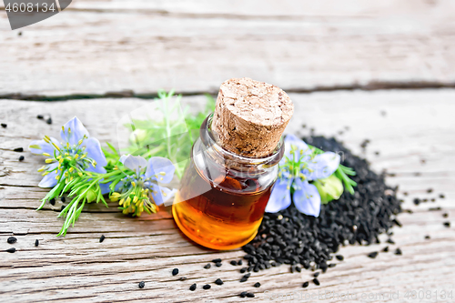 Image of Oil kalingi in bottle on old wooden board