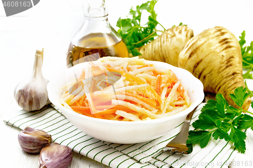 Image of Salad of parsnip and carrot on board