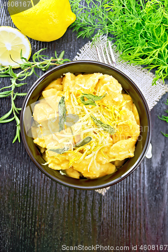 Image of Gnocchi pumpkin in bowl on dark wooden board top