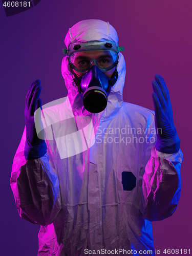 Image of Doctor wearing protective biological suit and mask due to corona