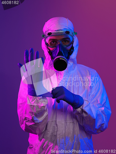Image of Doctor wearing protective biological suit and mask due to corona