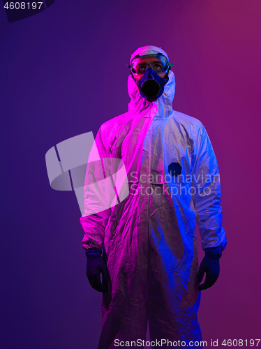 Image of Doctor wearing protective biological suit and mask due to corona