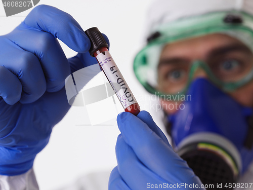 Image of Coronavirus, Doctor holding positive covid-19 virus Blood Sample