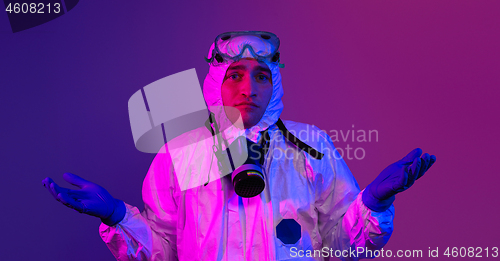 Image of Doctor wearing protective biological suit and mask due to corona