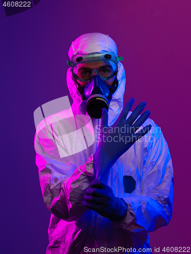 Image of Doctor wearing protective biological suit and mask due to corona