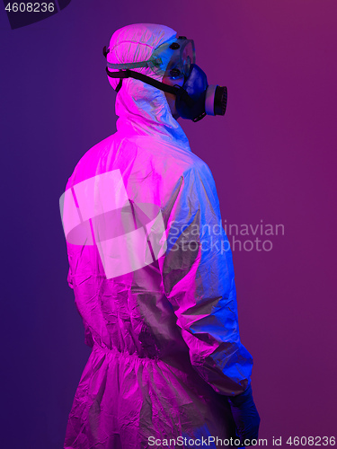 Image of Doctor wearing protective biological suit and mask due to corona