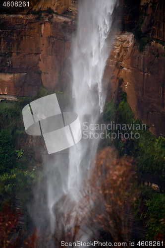 Image of Powerful waterfall tumbling over sandstone cliffs 