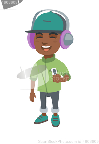 Image of African boy listening to music in headphones.