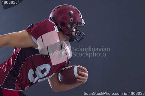 Image of American football Player running with the ball