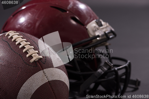 Image of american football and helmets isolated on gray