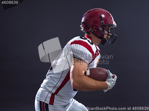 Image of American football Player running with the ball