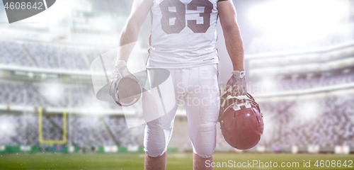 Image of closeup American Football Player isolated on big modern stadium