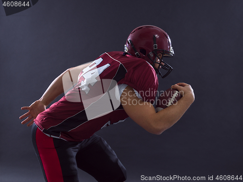 Image of American football Player running with the ball