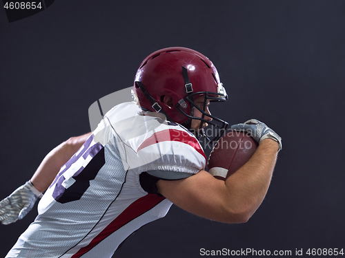 Image of American football Player running with the ball