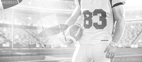 Image of closeup American Football Player isolated on big modern stadium