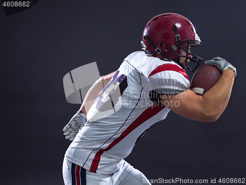 Image of American football Player running with the ball