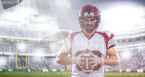 Image of American Football Player isolated on big modern stadium field