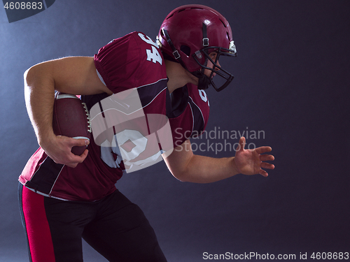 Image of American football Player running with the ball
