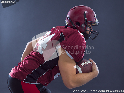 Image of American football Player running with the ball