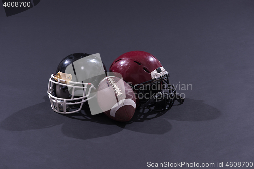 Image of american football and helmets isolated on gray