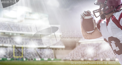 Image of American football Player running with the ball