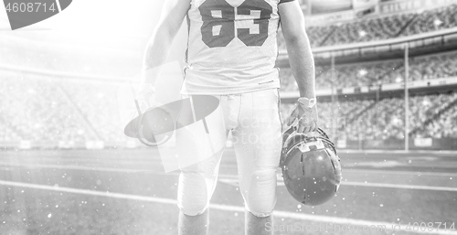 Image of closeup American Football Player isolated on big modern stadium