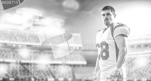 Image of American Football Player isolated on big modern stadium field