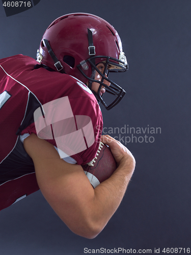 Image of American football Player running with the ball