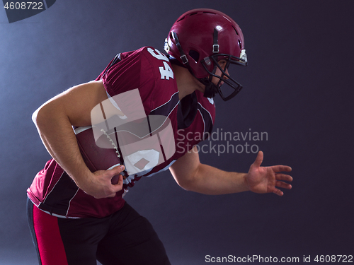 Image of American football Player running with the ball