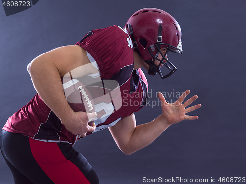 Image of American football Player running with the ball