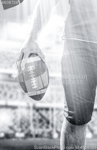 Image of closeup American Football Player isolated on big modern stadium