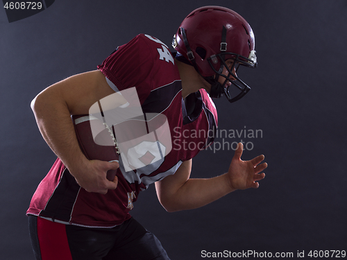 Image of American football Player running with the ball