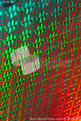 Image of Texture of red foil with holographic effect. Christmas background.