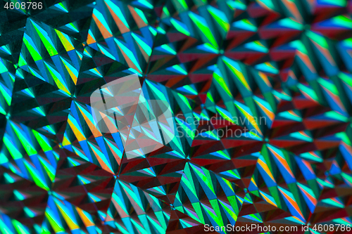 Image of Texture of red foil with holographic effect. Christmas background.