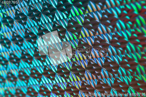 Image of Texture of red foil with holographic effect. Christmas background.