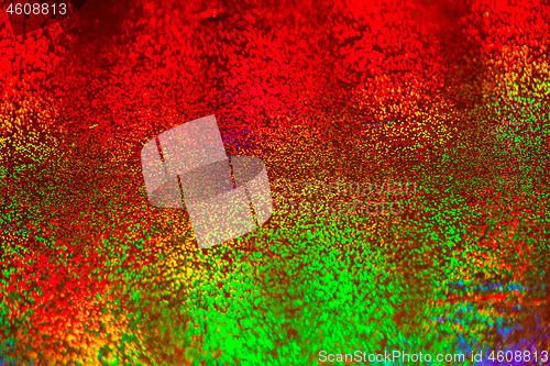 Image of Texture of red foil with holographic effect. Christmas background.