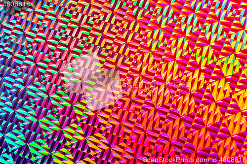 Image of Texture of red foil with holographic effect. Christmas background.