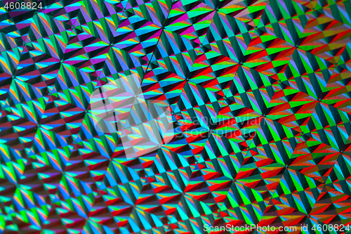 Image of Texture of red foil with holographic effect. Christmas background.