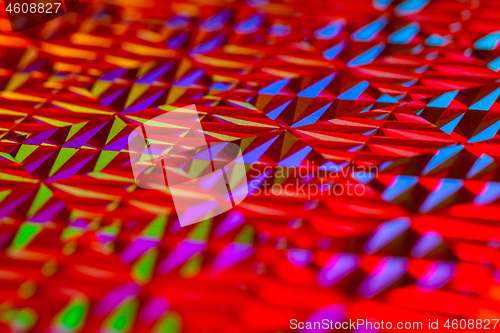 Image of Texture of red foil with holographic effect. Christmas background.